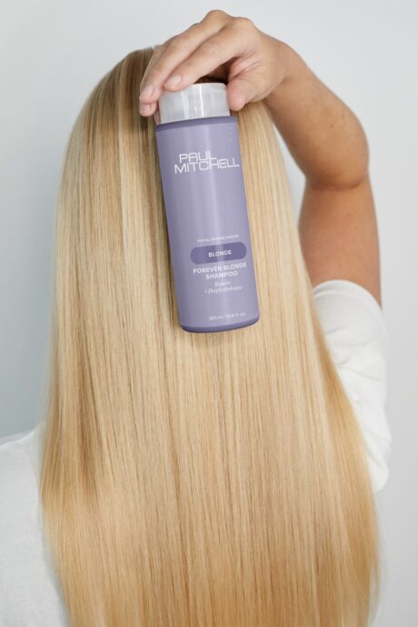forever-blonde-shampoo-model-in-hand-restage